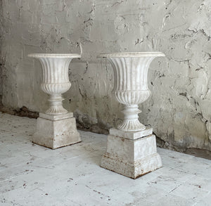 Pair Of Late 19th Century Cast Iron Urns On Plinths